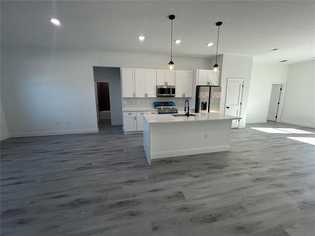 555 Marion Oaks Golf Road Ocala, FL 34473 - Photo 23 of 34 a view of kitchen with wooden floor