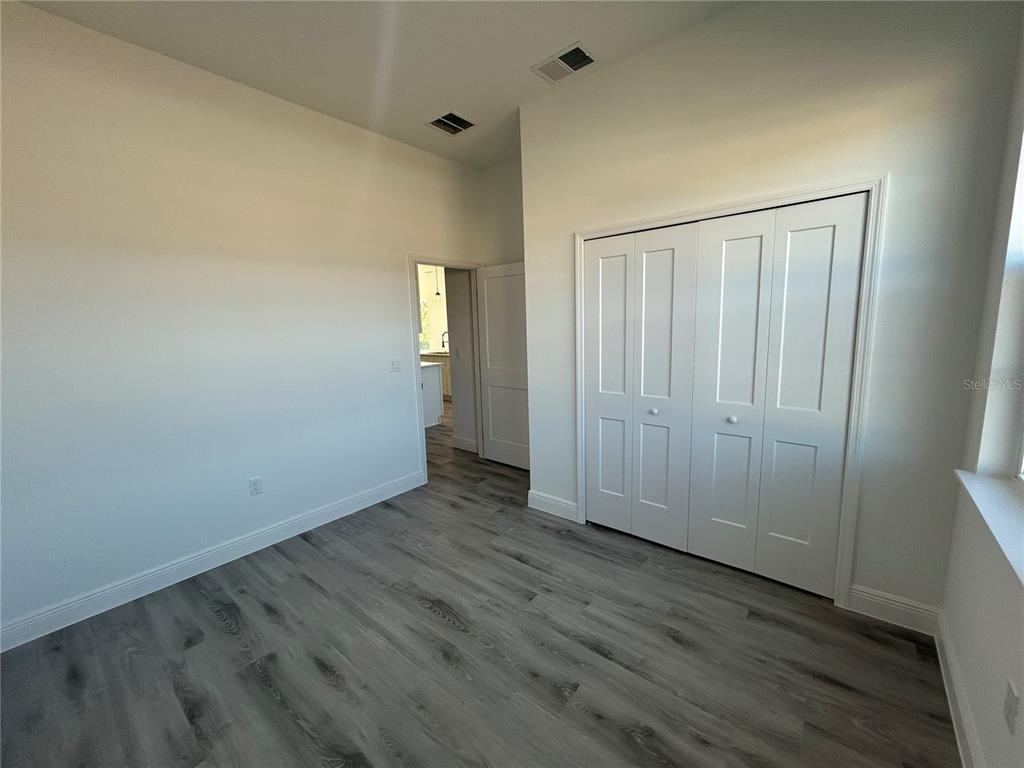 555 Marion Oaks Golf Road Ocala, FL 34473 - Photo 25 of 34 an empty room with wooden floor