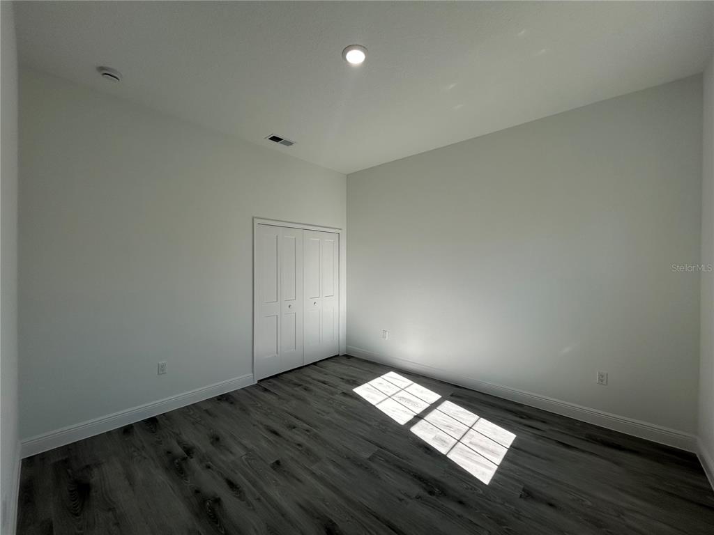 555 Marion Oaks Golf Road Ocala, FL 34473 - Photo 29 of 34 a view of wooden floor and windows in a room