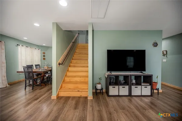 a kitchen with a sink appliances and cabinets