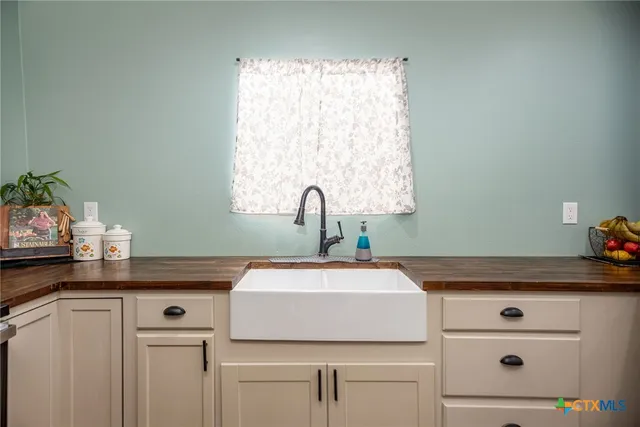 a kitchen with appliances and cabinets