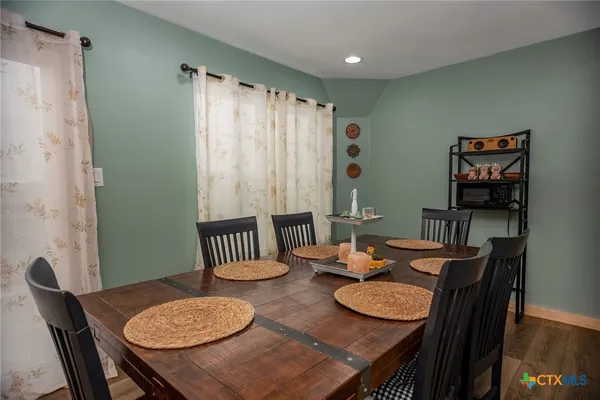a view of a dining room with furniture