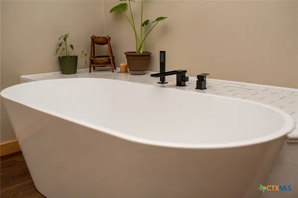 a living room with lots of furniture and washer