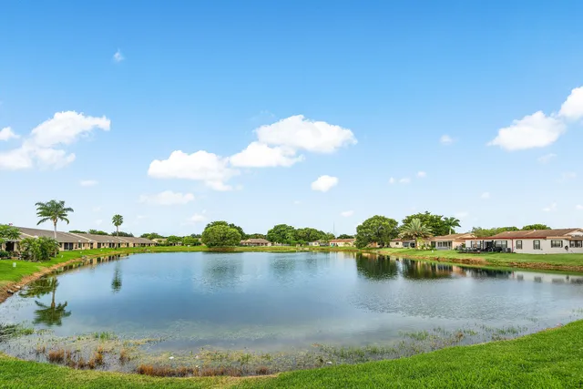 a view of a lake with a big yard