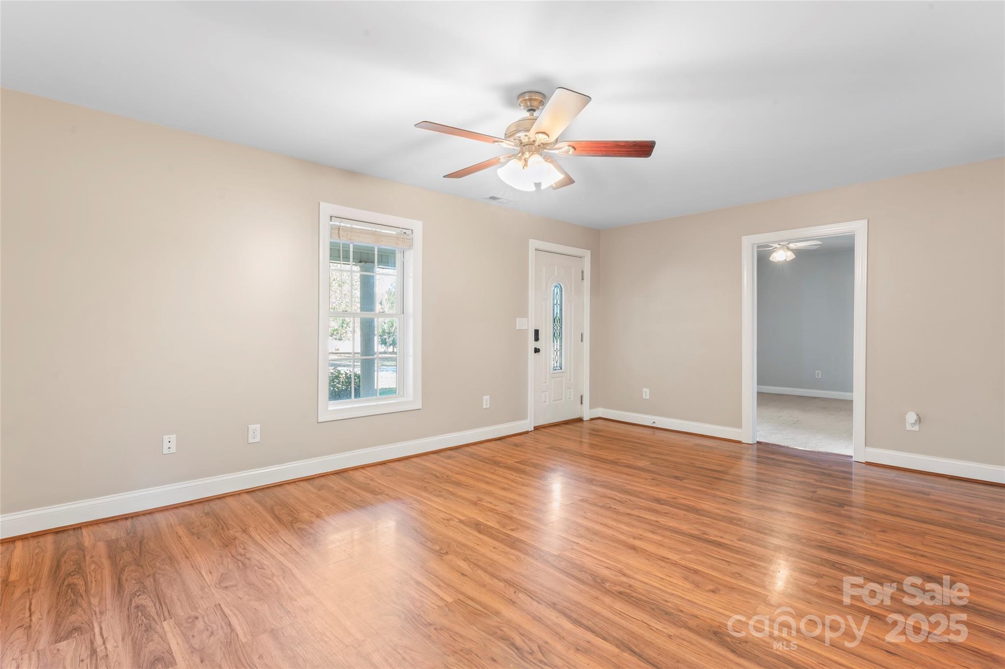 8450 Red Road Rockwell, NC 28138 - Photo 13 of 48 a view of an empty room with wooden floor and a window