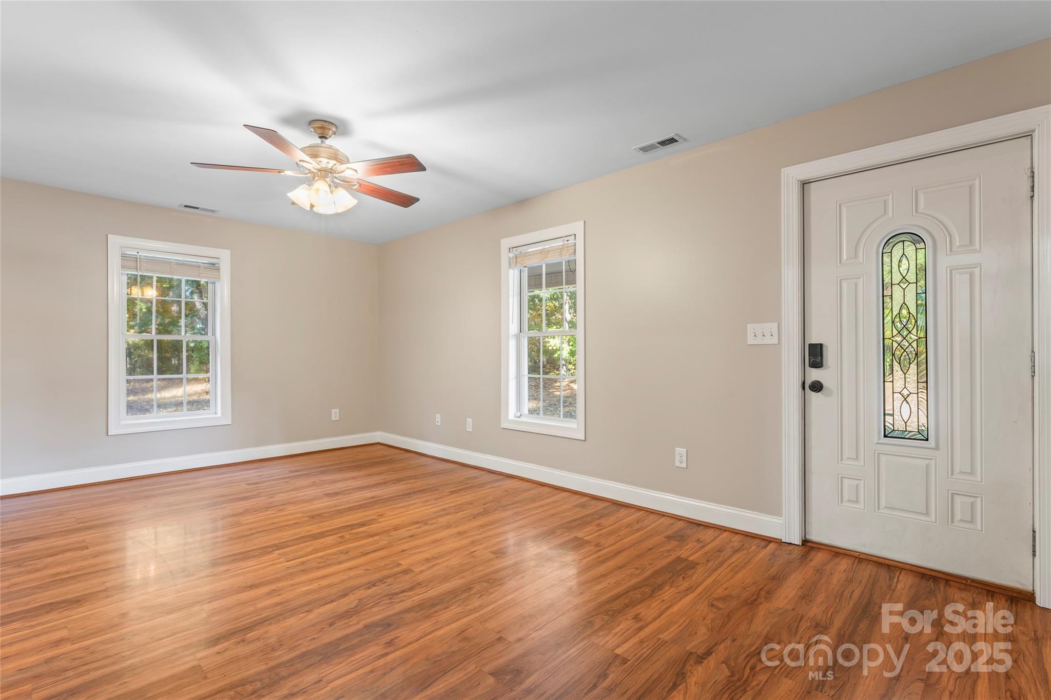 8450 Red Road Rockwell, NC 28138 - Photo 14 of 48 a view of an empty room with window and wooden floor
