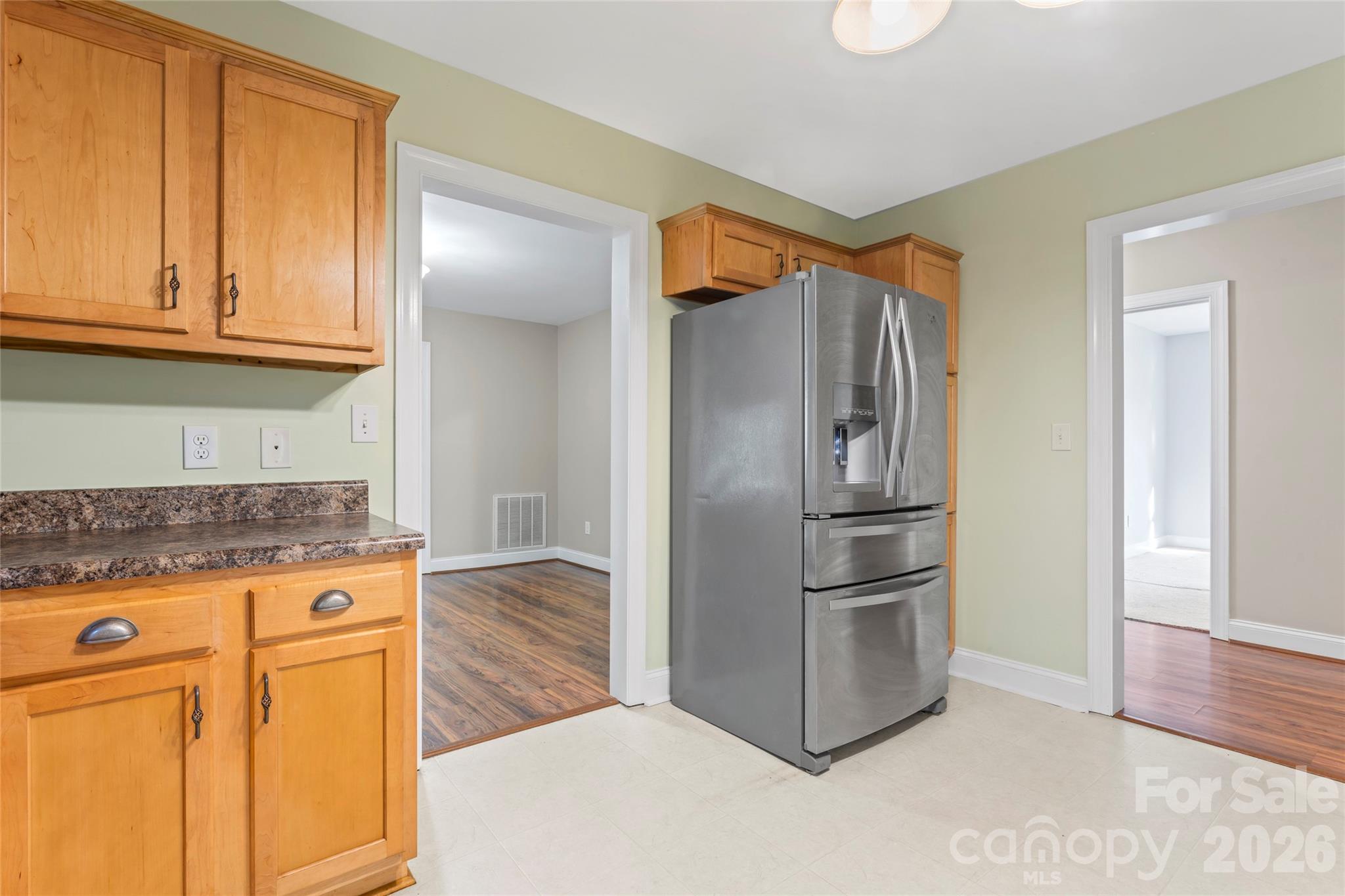 8450 Red Road Rockwell, NC 28138 - Photo 23 of 48 a kitchen with stainless steel appliances granite countertop a refrigerator and a stove top oven