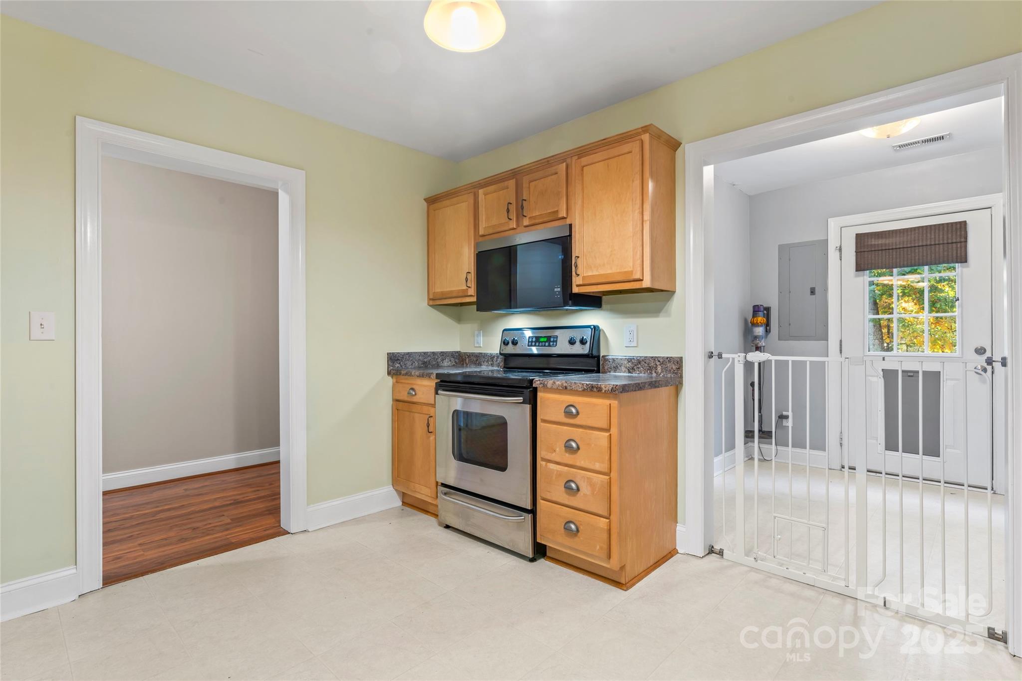 8450 Red Road Rockwell, NC 28138 - Photo 24 of 48 a kitchen with stainless steel appliances a stove a microwave and a refrigerator