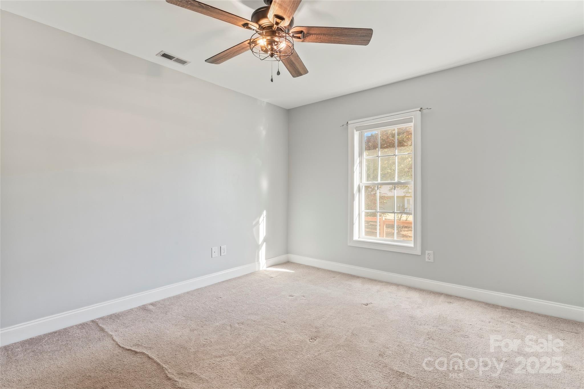 8450 Red Road Rockwell, NC 28138 - Photo 26 of 48 an empty room with windows and fan