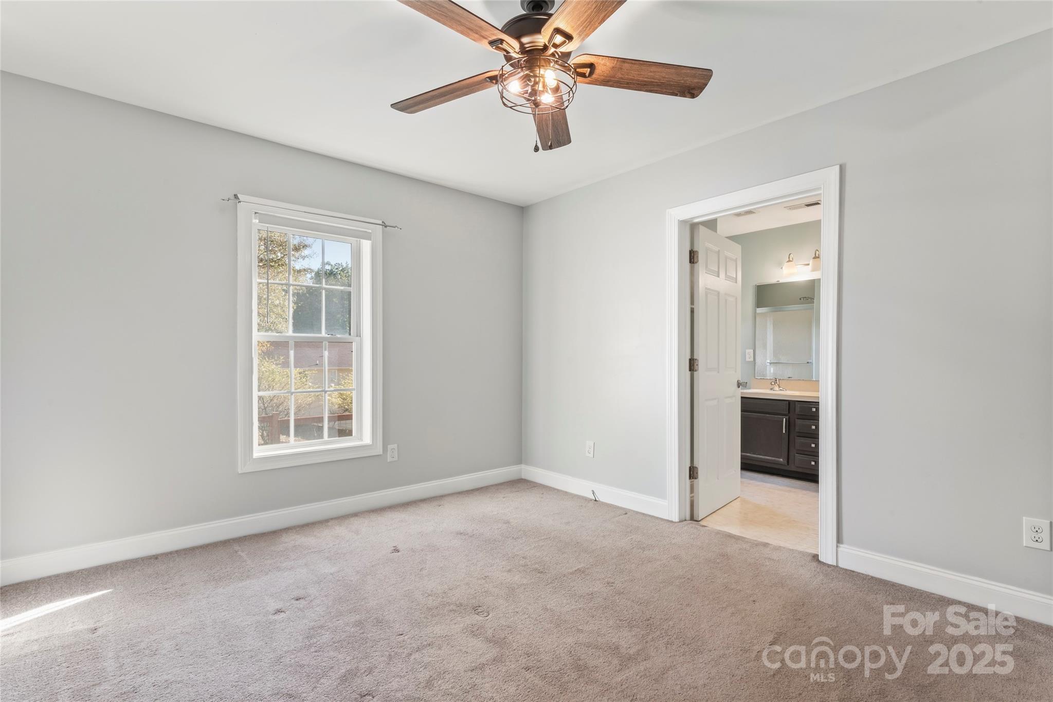 8450 Red Road Rockwell, NC 28138 - Photo 27 of 48 an empty room with chandelier fan and windows