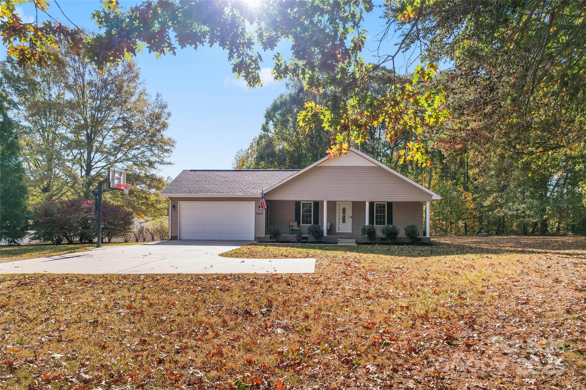 8450 Red Road Rockwell, NC 28138 - Photo 3 of 48 a front view of a house with a yard and trees