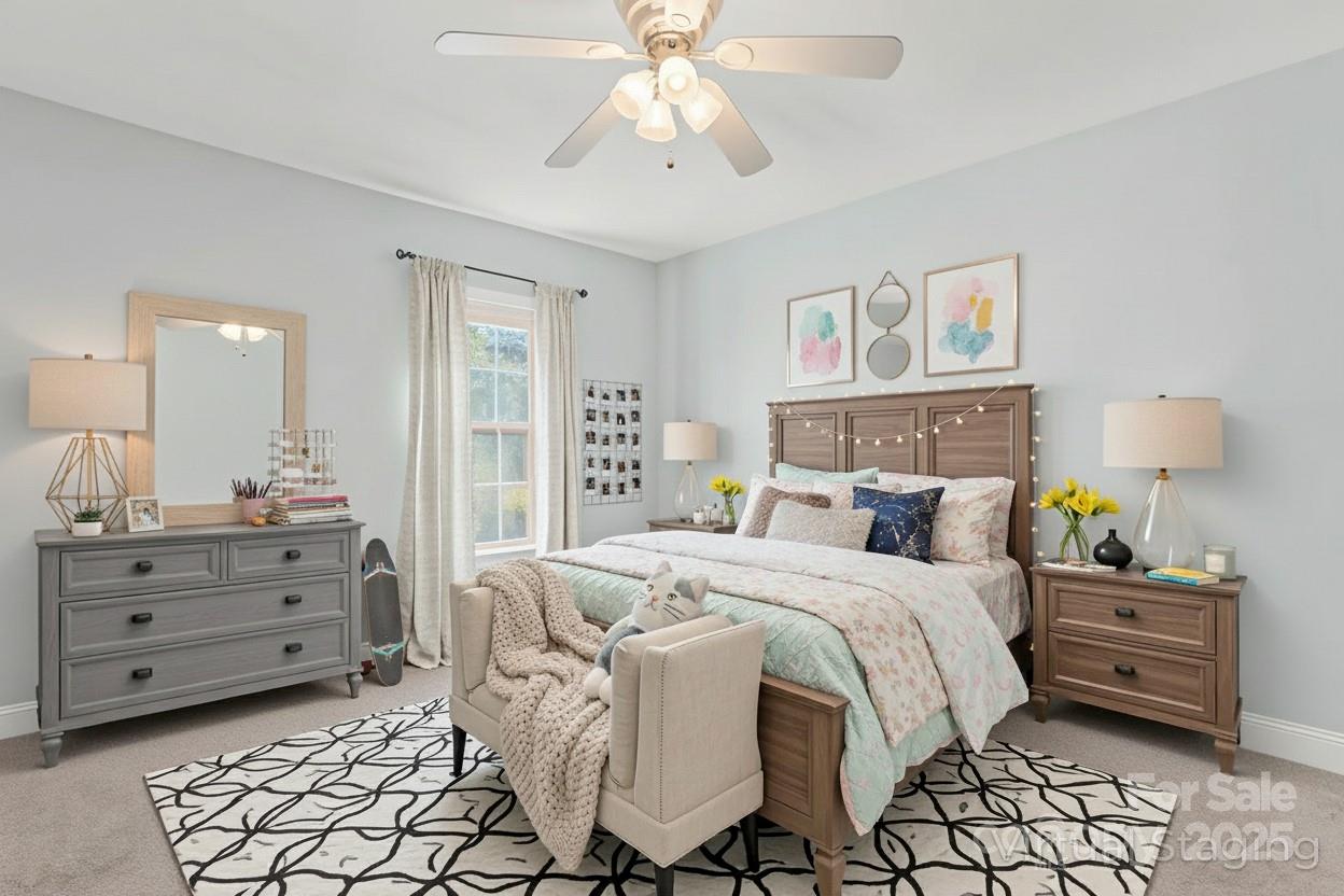 8450 Red Road Rockwell, NC 28138 - Photo 31 of 48 a bedroom with a bed and a chandelier