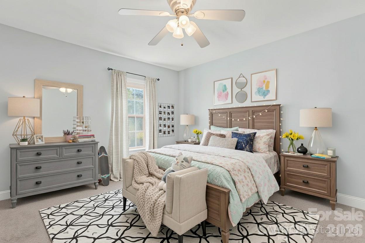 8450 Red Road Rockwell, NC 28138 - Photo 31 of 48 a bedroom with a bed and a chandelier