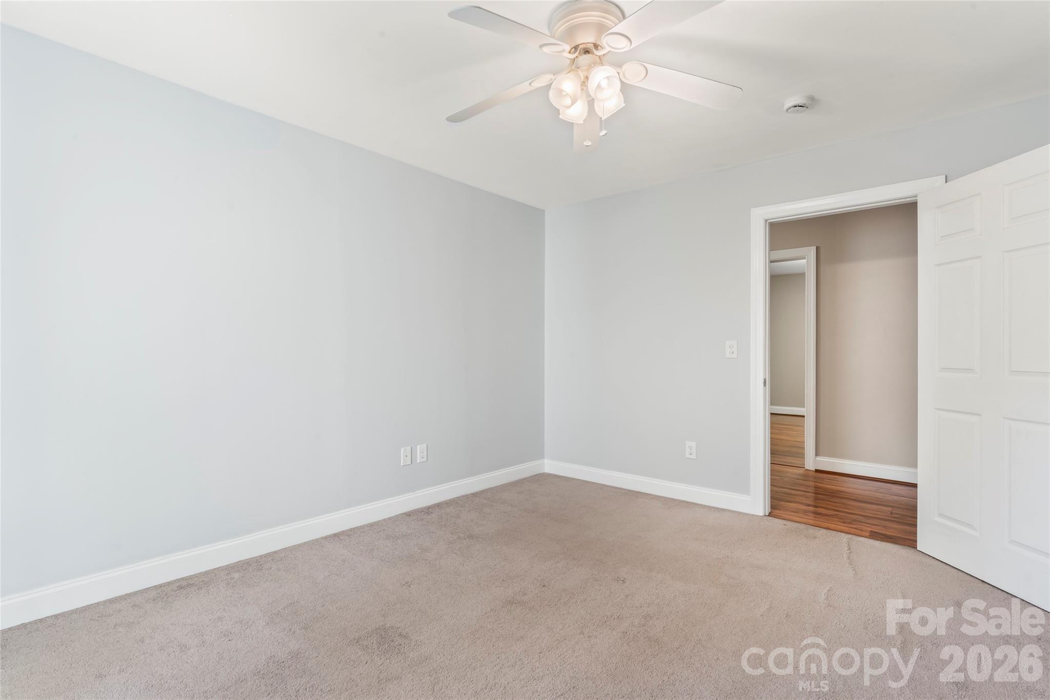8450 Red Road Rockwell, NC 28138 - Photo 33 of 48 an empty room with a chandelier fan and a chandelier fan