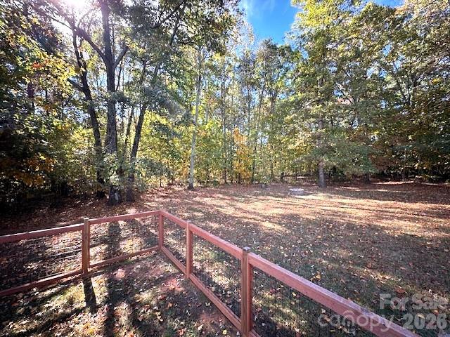 8450 Red Road Rockwell, NC 28138 - Photo 39 of 48 a view of a yard with wooden fence