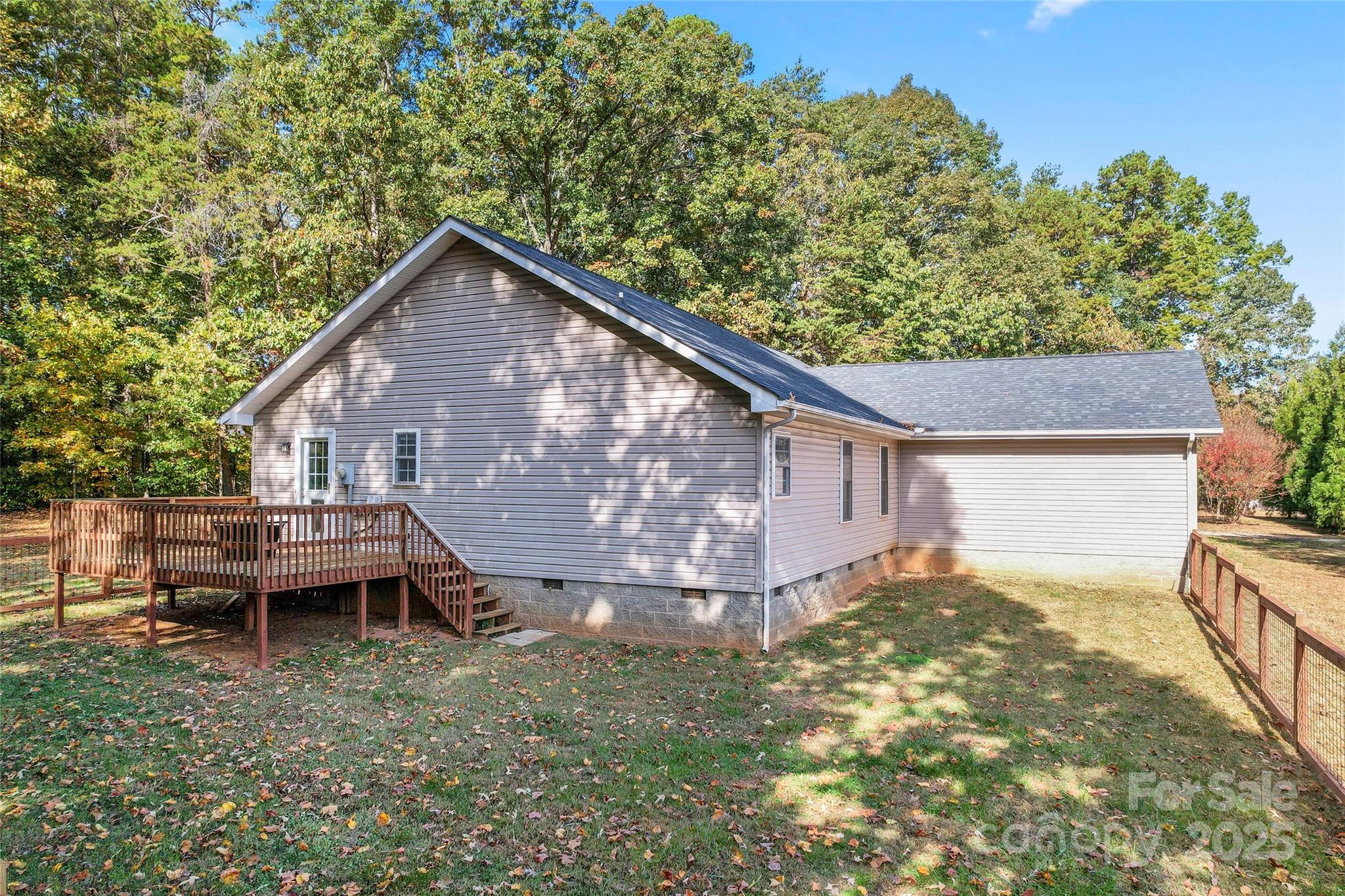 8450 Red Road Rockwell, NC 28138 - Photo 40 of 48 a backyard of a house with table and chairs