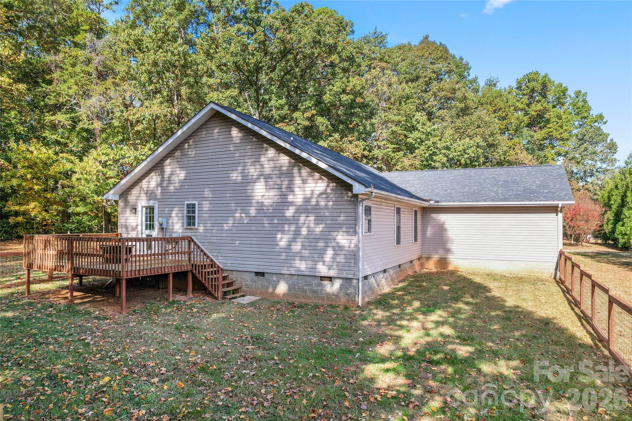 8450 Red Road Rockwell, NC 28138 - Photo 40 of 48 a backyard of a house with table and chairs