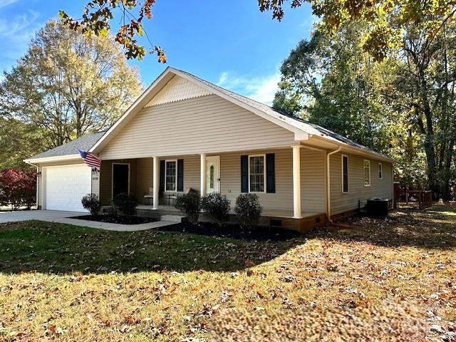 8450 Red Road Rockwell, NC 28138 - Photo 4 of 48 a front view of a house with a yard