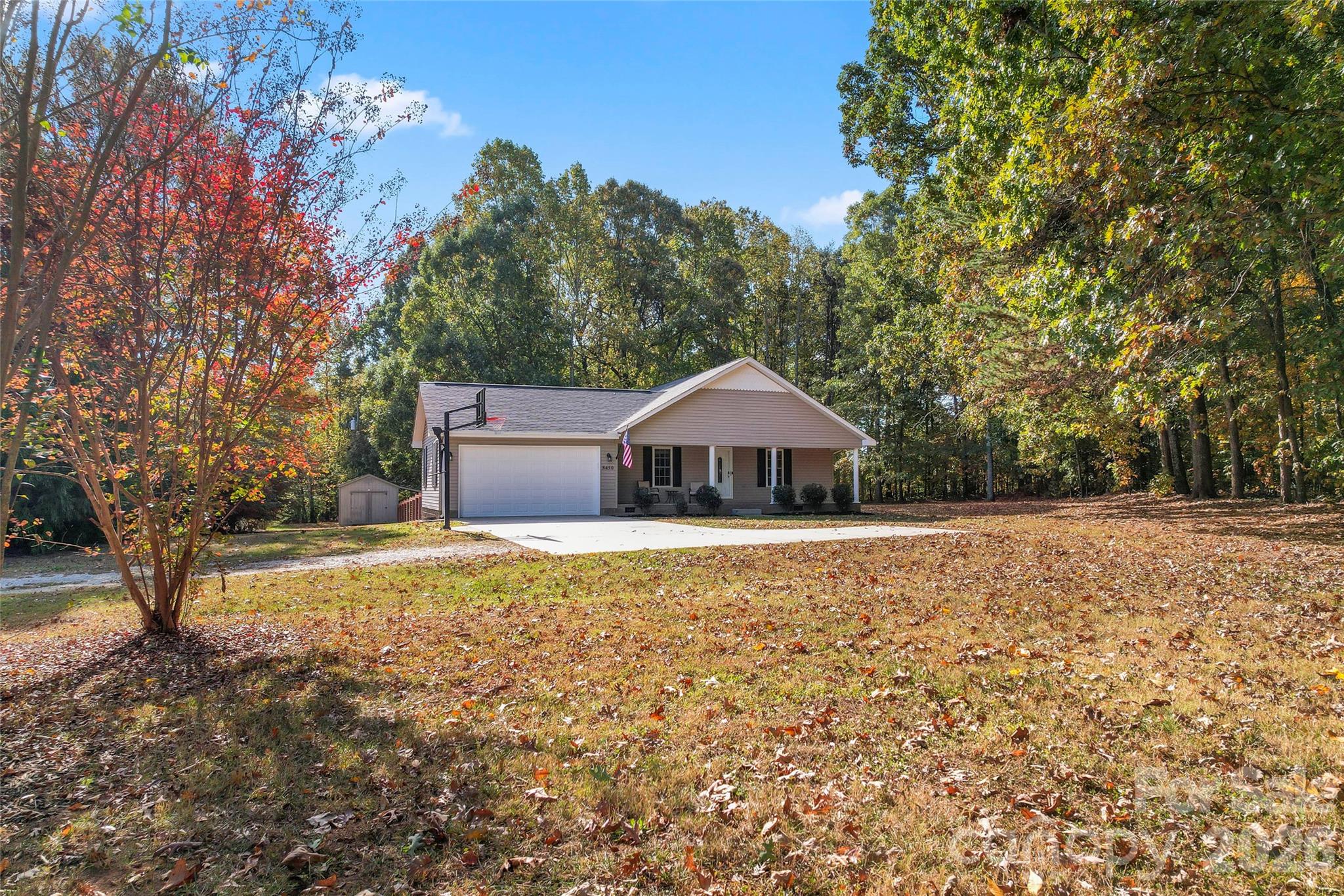 8450 Red Road Rockwell, NC 28138 - Photo 7 of 48 a front view of a house with yard and trees