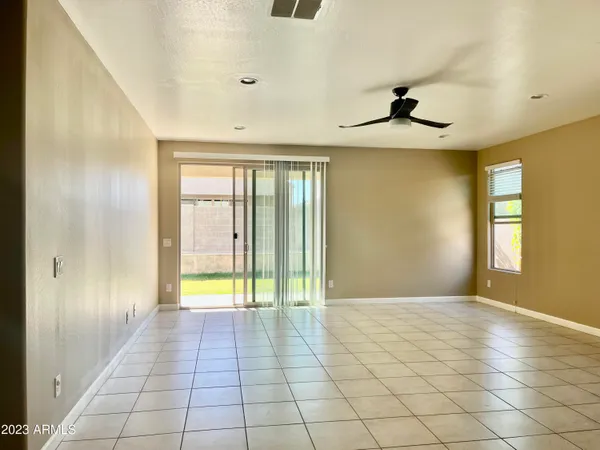 a view of an empty room with glass door