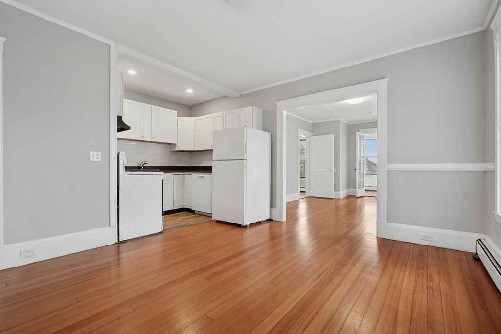 55 Summer Street, Unit 1 Haverhill, MA 01830 - Photo 4 of 13 a view of kitchen with wooden floor and electronic appliances