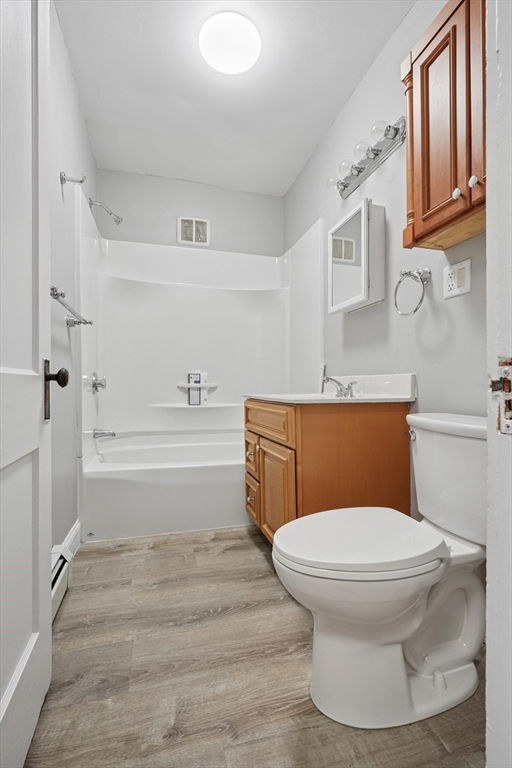 55 Summer Street, Unit 1 Haverhill, MA 01830 - Photo 7 of 13 a bathroom with a toilet and a shower