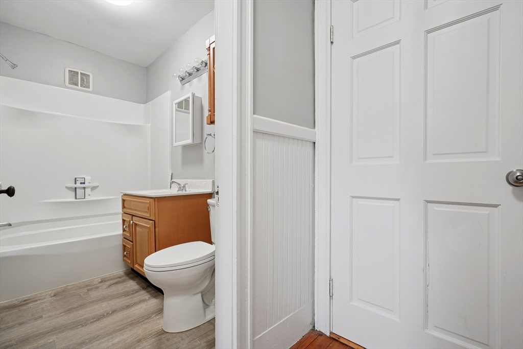 55 Summer Street, Unit 1 Haverhill, MA 01830 - Photo 8 of 13 a bathroom with a toilet and a shower