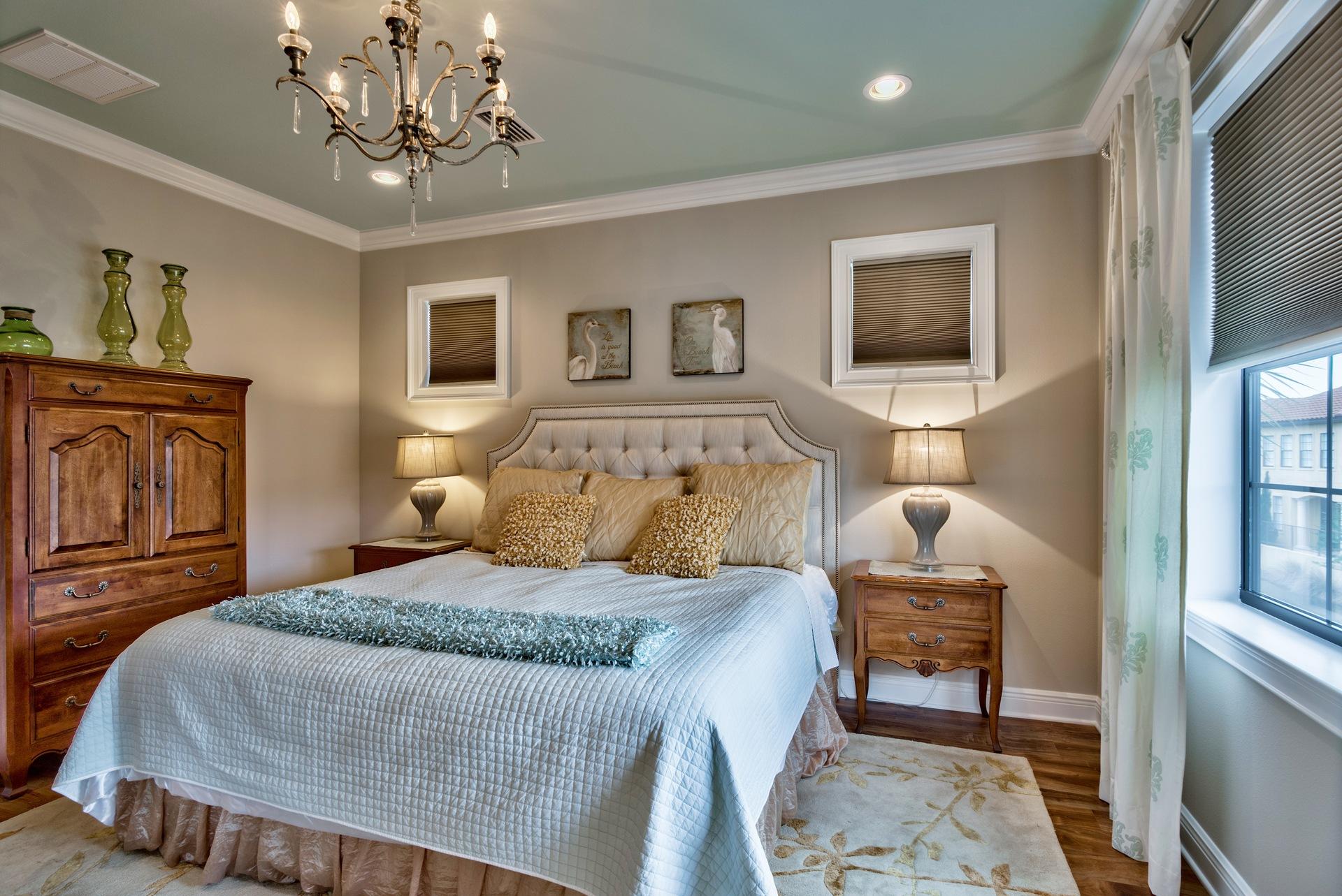 1976 Baytowne Loop Miramar Beach, FL 32550 - Photo 12 of 23 a bedroom with a large bed and a chandelier