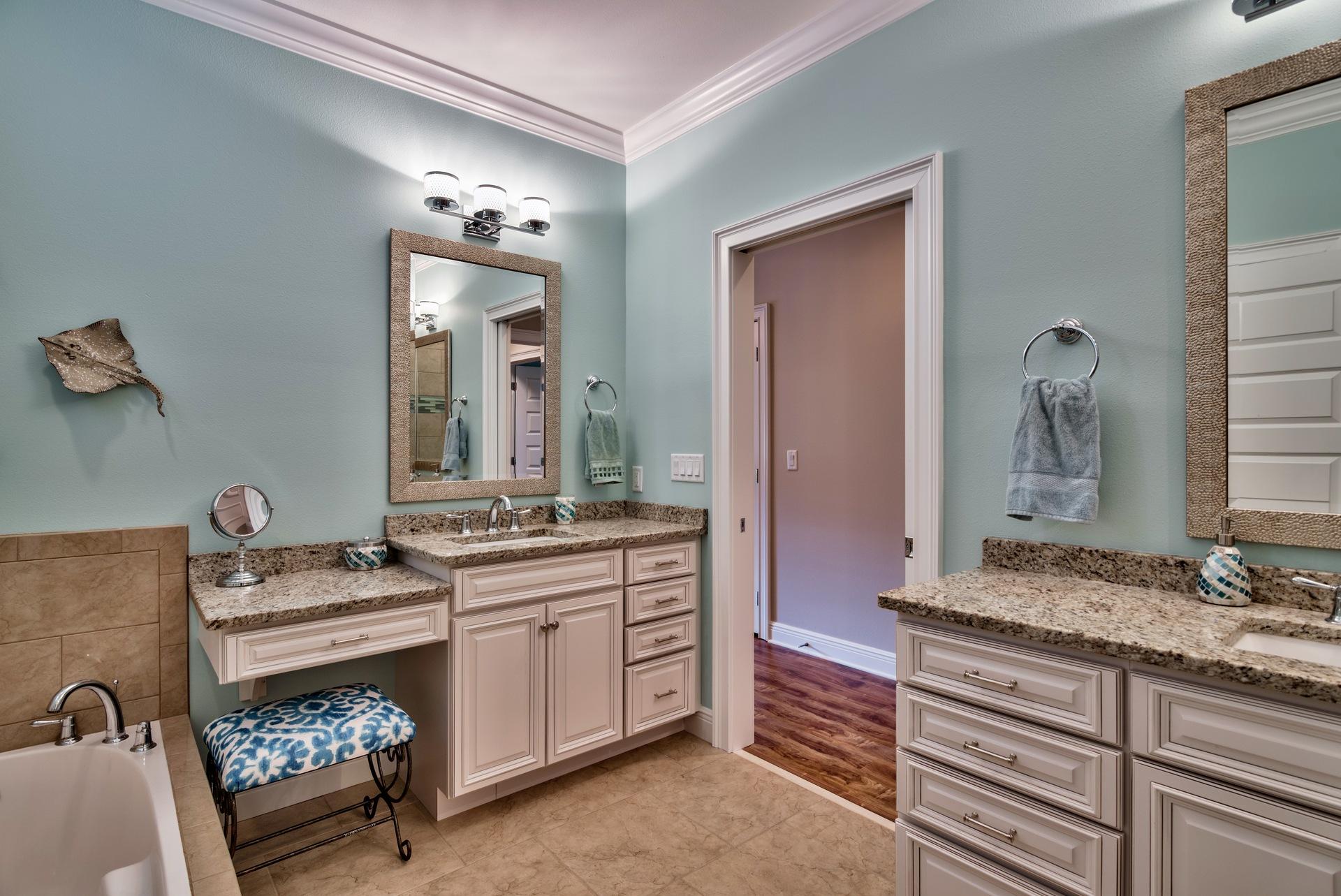 1976 Baytowne Loop Miramar Beach, FL 32550 - Photo 16 of 23 a spacious bathroom with a granite countertop double vanity and a mirror