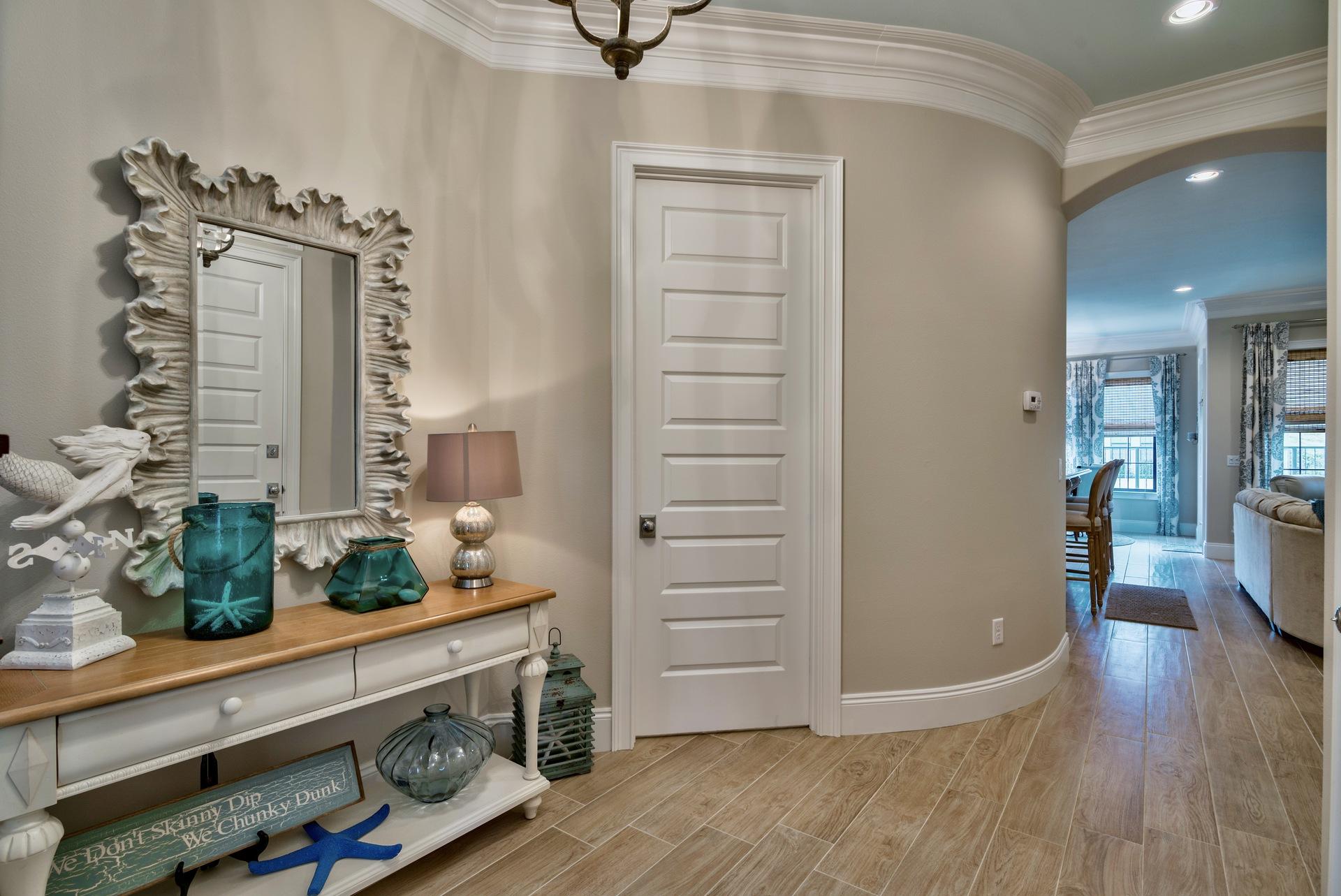 1976 Baytowne Loop Miramar Beach, FL 32550 - Photo 3 of 23 a view of a hallway with wooden floor and staircase