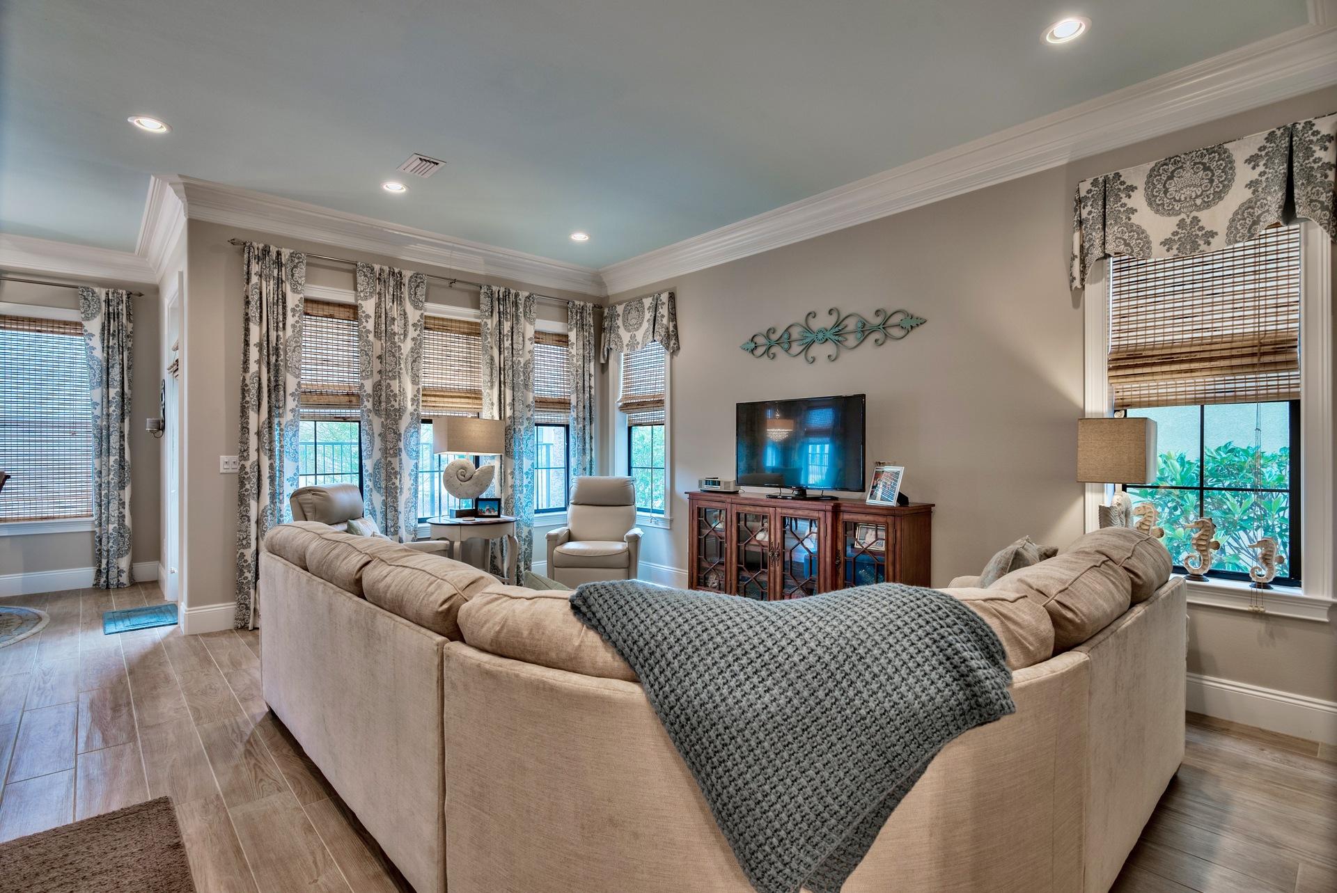 1976 Baytowne Loop Miramar Beach, FL 32550 - Photo 6 of 23 a living room with furniture a large window and a flat screen tv