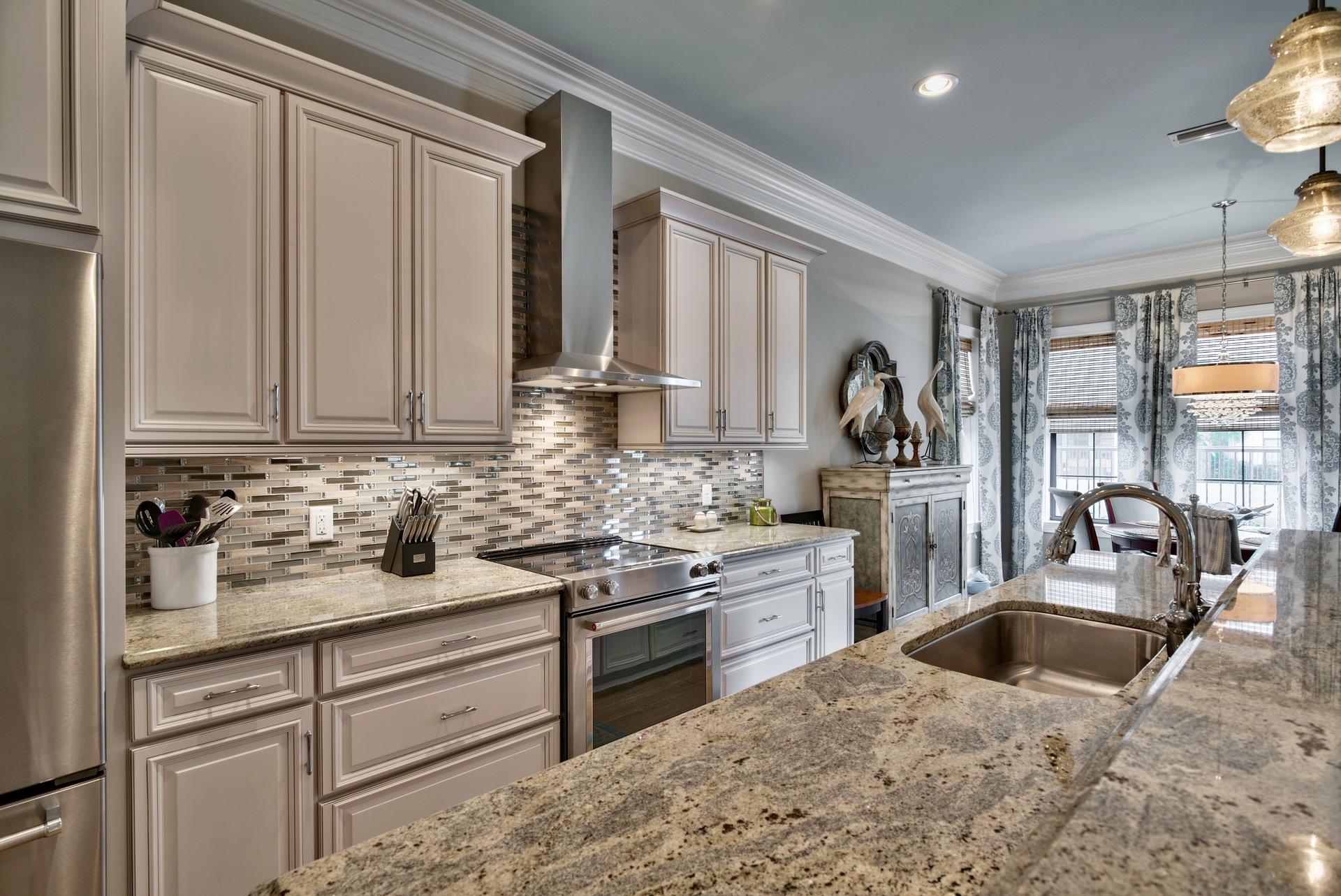 1976 Baytowne Loop Miramar Beach, FL 32550 - Photo 8 of 23 a kitchen with stainless steel appliances granite countertop a sink stove and cabinets