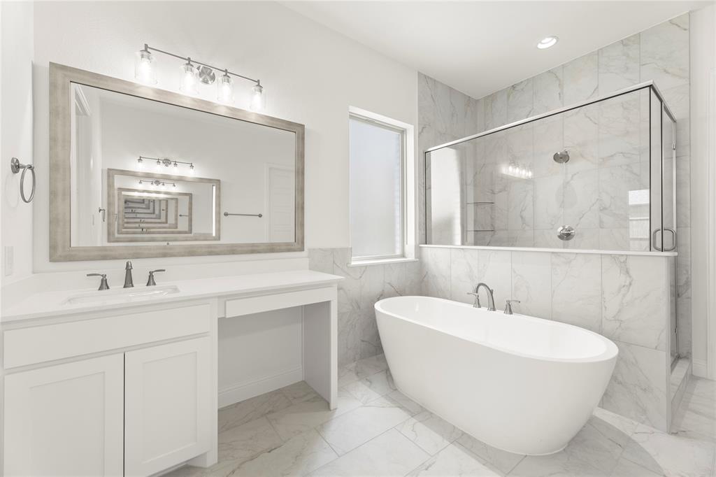 1724 Ruby Way Rockwall, TX 75087 - Photo 16 of 29 a bathroom with a double vanity sink mirror and bathtub