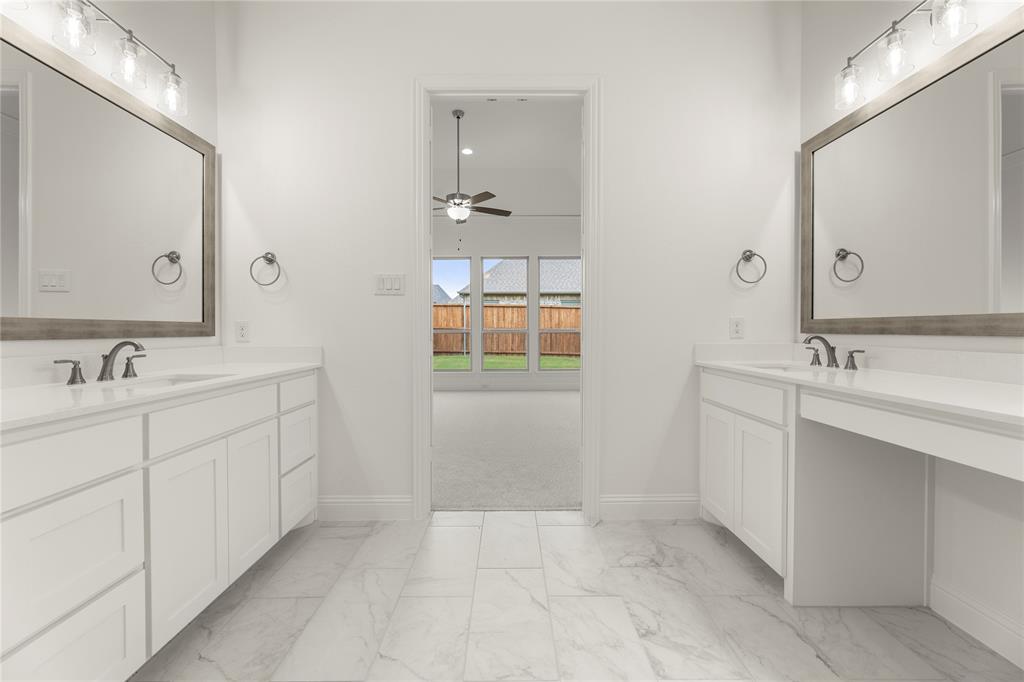 1724 Ruby Way Rockwall, TX 75087 - Photo 17 of 29 a spacious bathroom with a double vanity sink a mirror and next