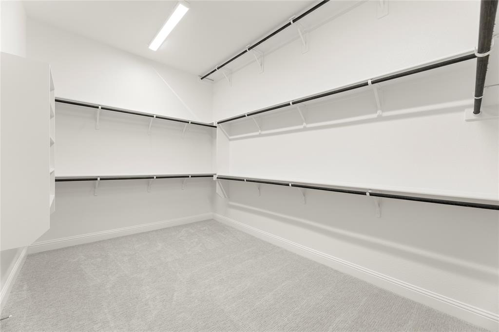 1724 Ruby Way Rockwall, TX 75087 - Photo 18 of 29 a view of an empty walk in closet