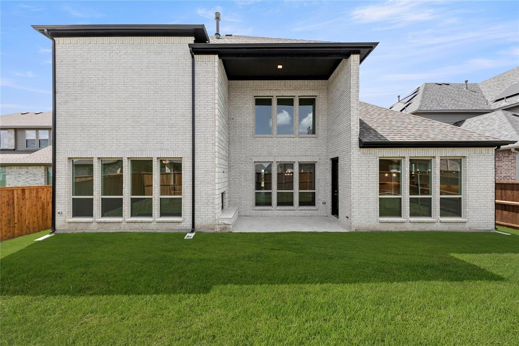 1724 Ruby Way Rockwall, TX 75087 - Photo 28 of 29 a front view of a house with a garden