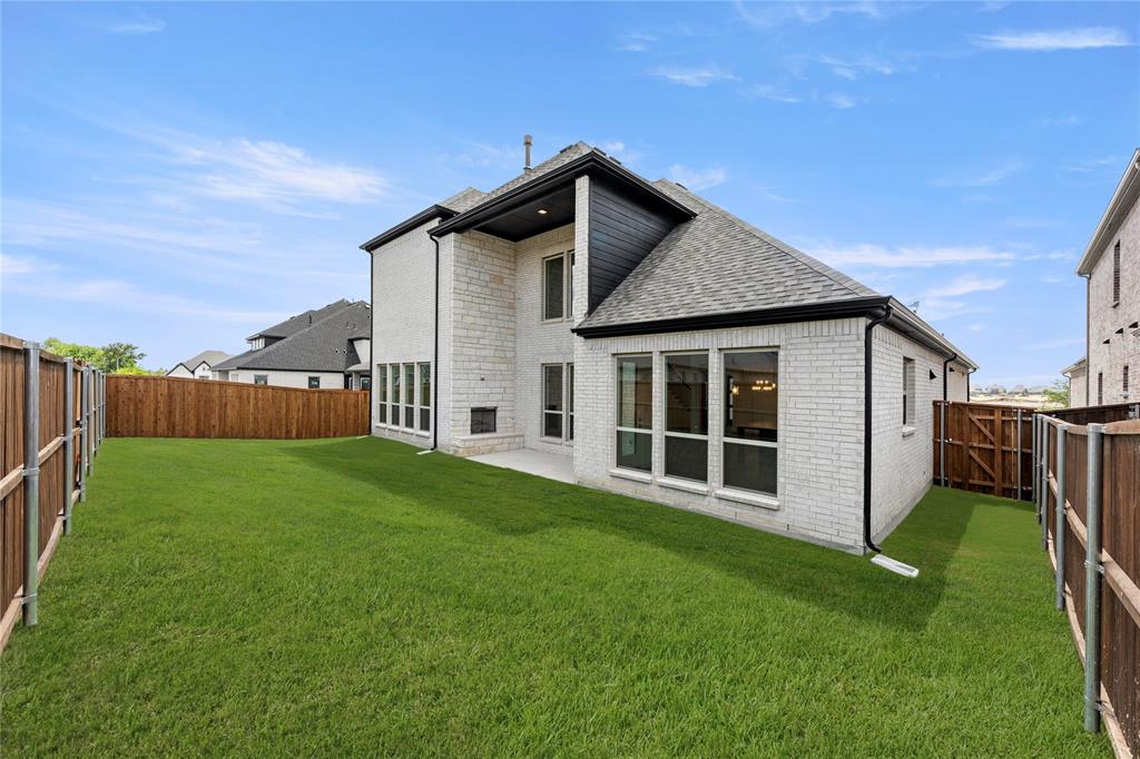 1724 Ruby Way Rockwall, TX 75087 - Photo 29 of 29 a view of a house with a yard
