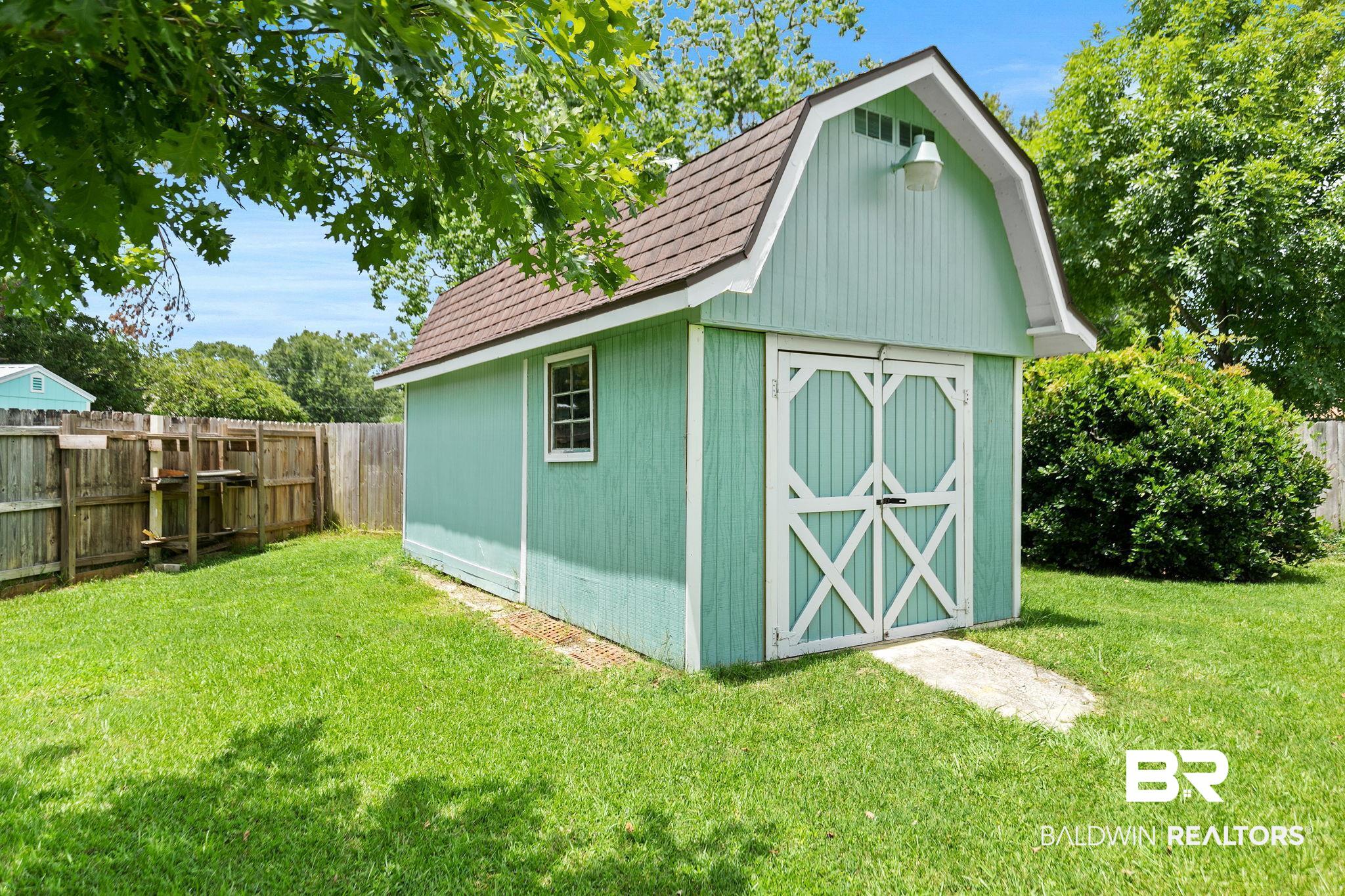 53 Magnolia Circle Foley, AL 36535 - Photo 7 of 33 View of outbuilding with a lawn