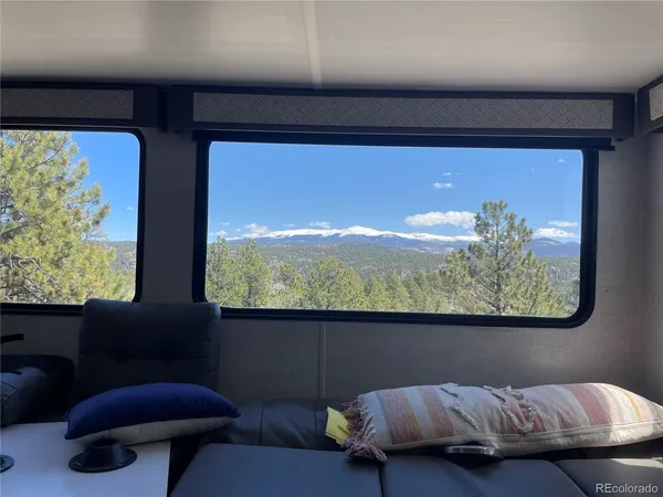 a view of a yard with wooden fence