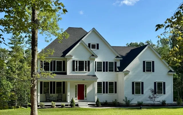 a front view of a house with a yard
