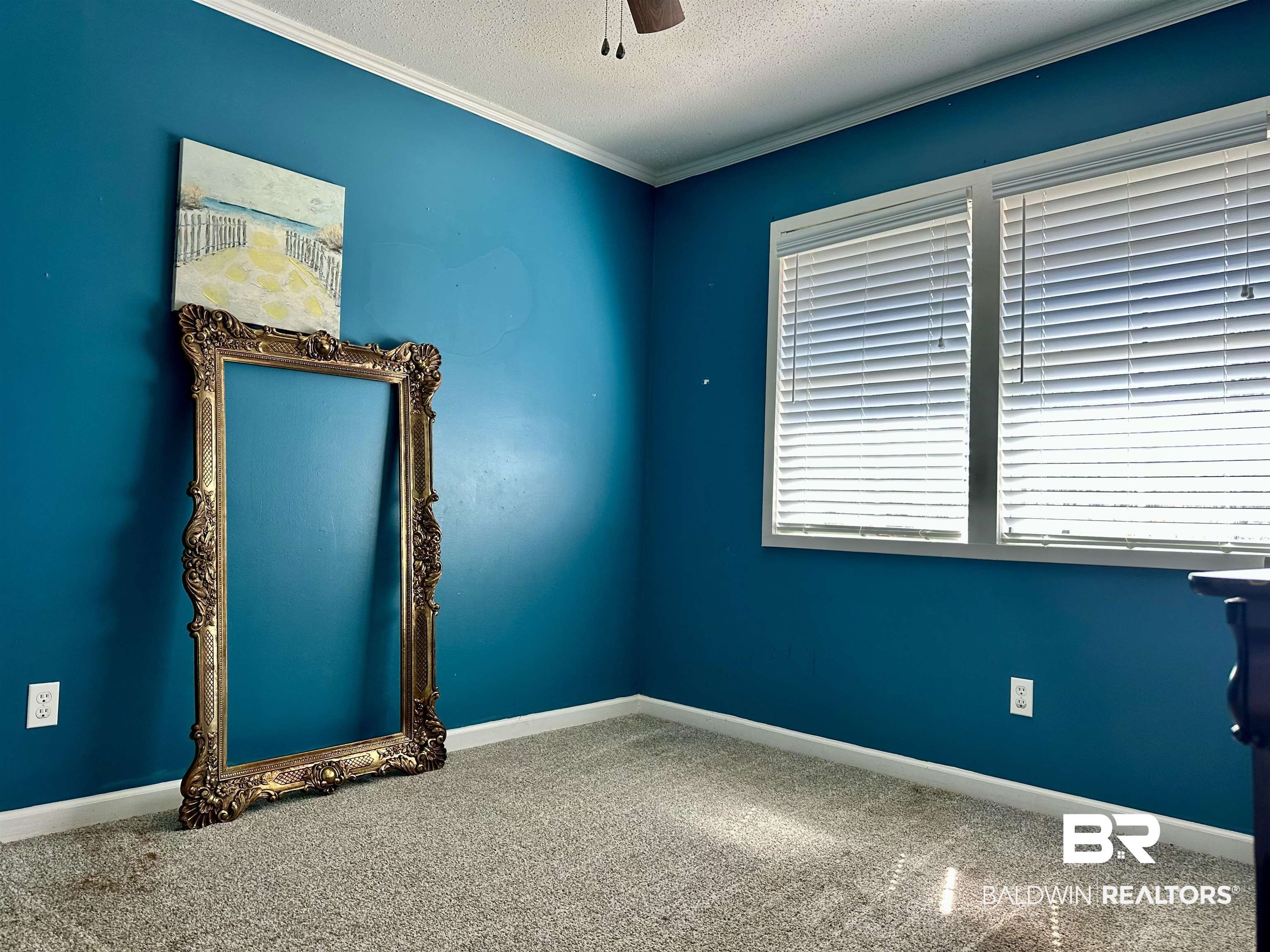 120 McGougin Road Brewton, AL 36426 - Photo 15 of 21 Empty room with carpet, crown molding, a textured ceiling, and baseboards