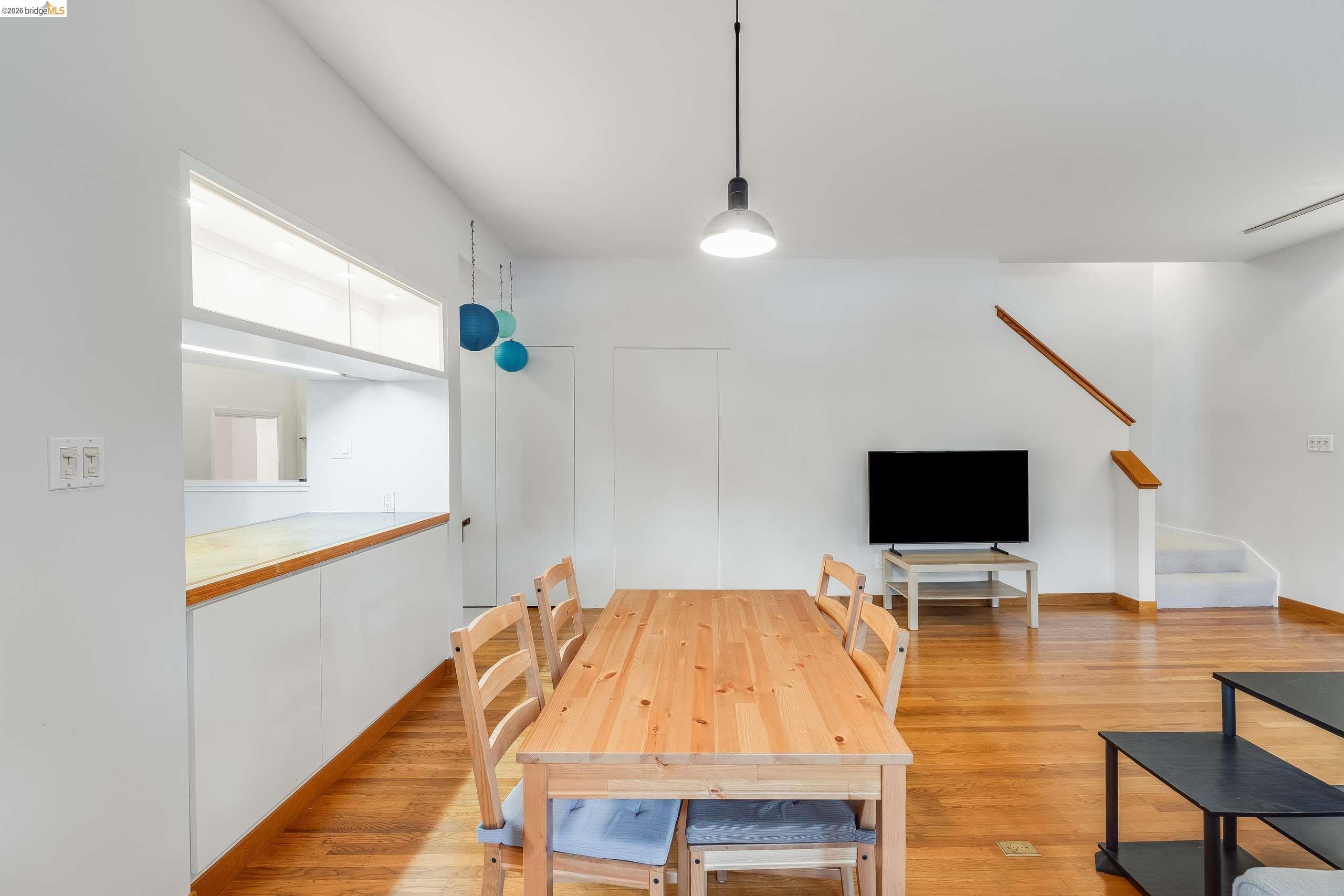 2316 Blake Street, Unit A Berkeley, CA 94704 - Photo 11 of 30 Dining room featuring light wood-style flooring and stairs