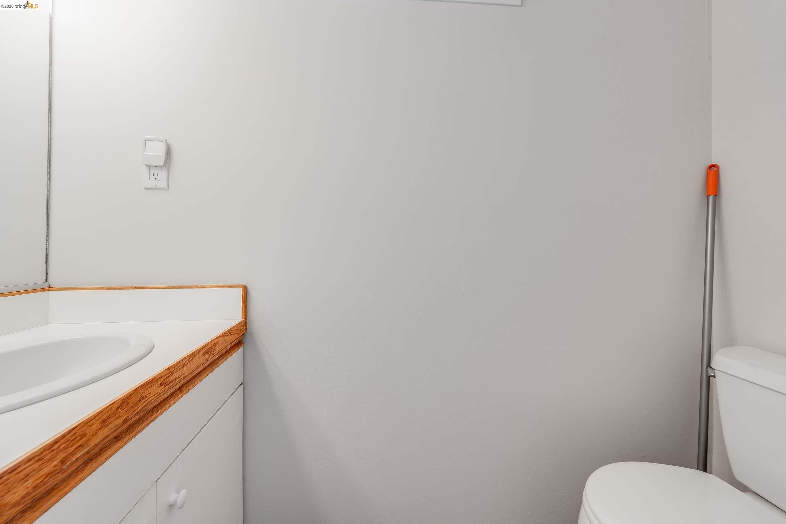 2316 Blake Street, Unit A Berkeley, CA 94704 - Photo 17 of 30 Half bath with vanity and toilet