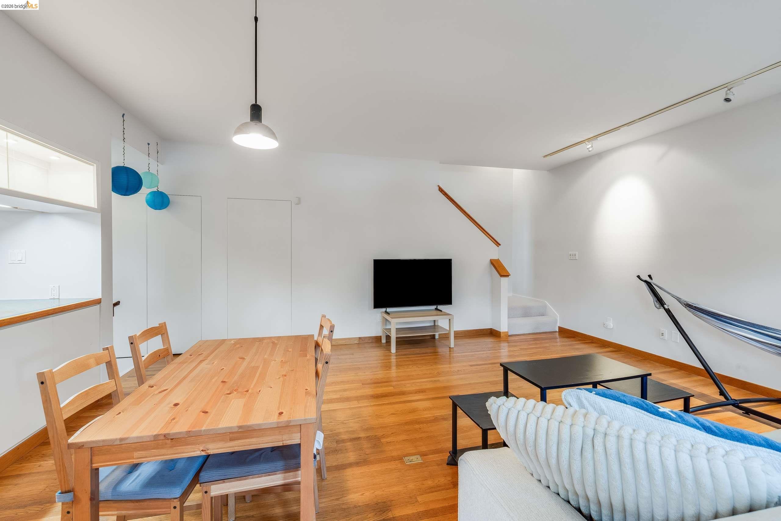 2316 Blake Street, Unit A Berkeley, CA 94704 - Photo 18 of 30 Living room with track lighting and wood finished floors