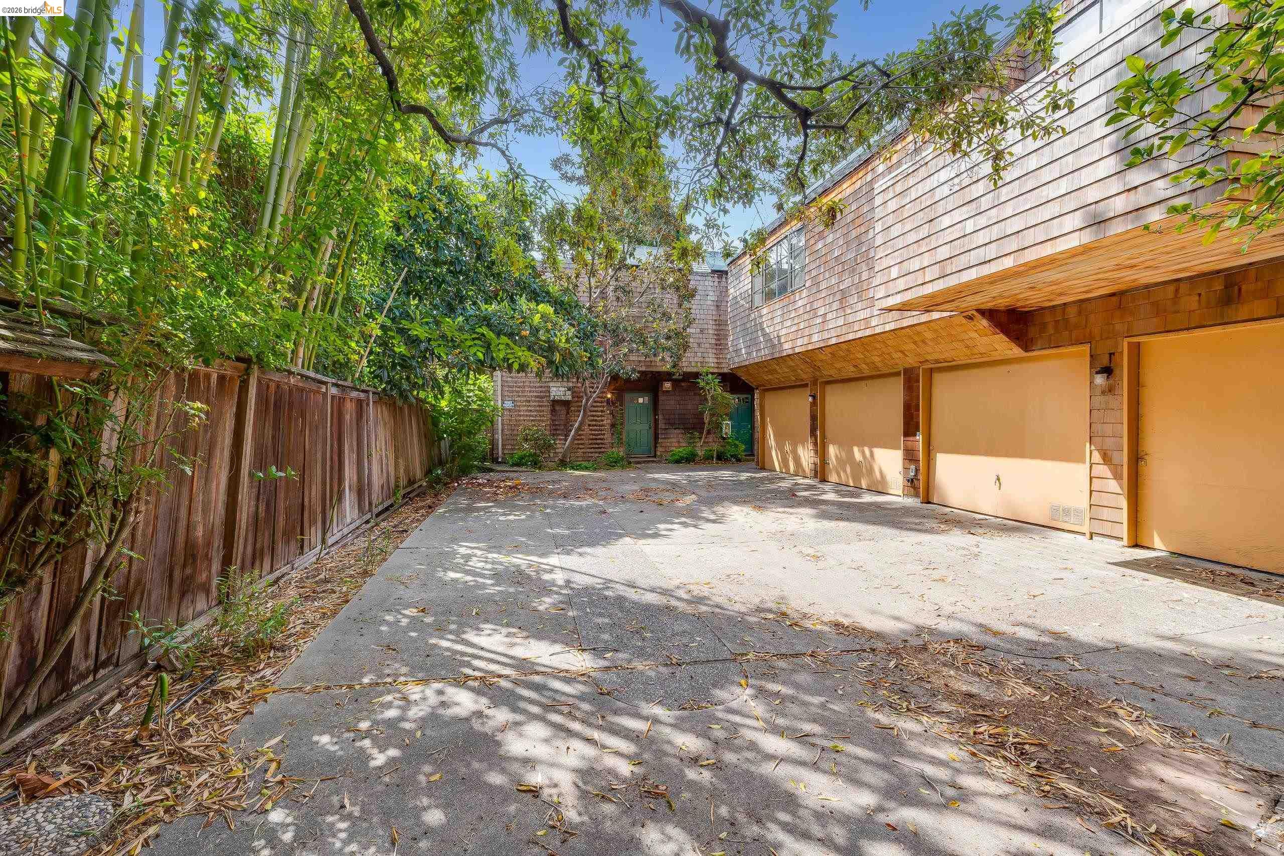 2316 Blake Street, Unit A Berkeley, CA 94704 - Photo 2 of 30 View of patio / terrace with concrete driveway and a garage