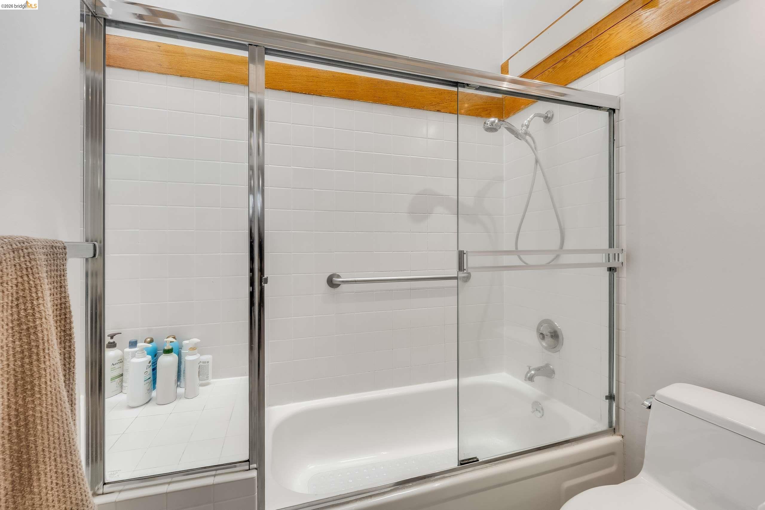 2316 Blake Street, Unit A Berkeley, CA 94704 - Photo 21 of 30 Full bathroom featuring enclosed tub / shower combo and toilet