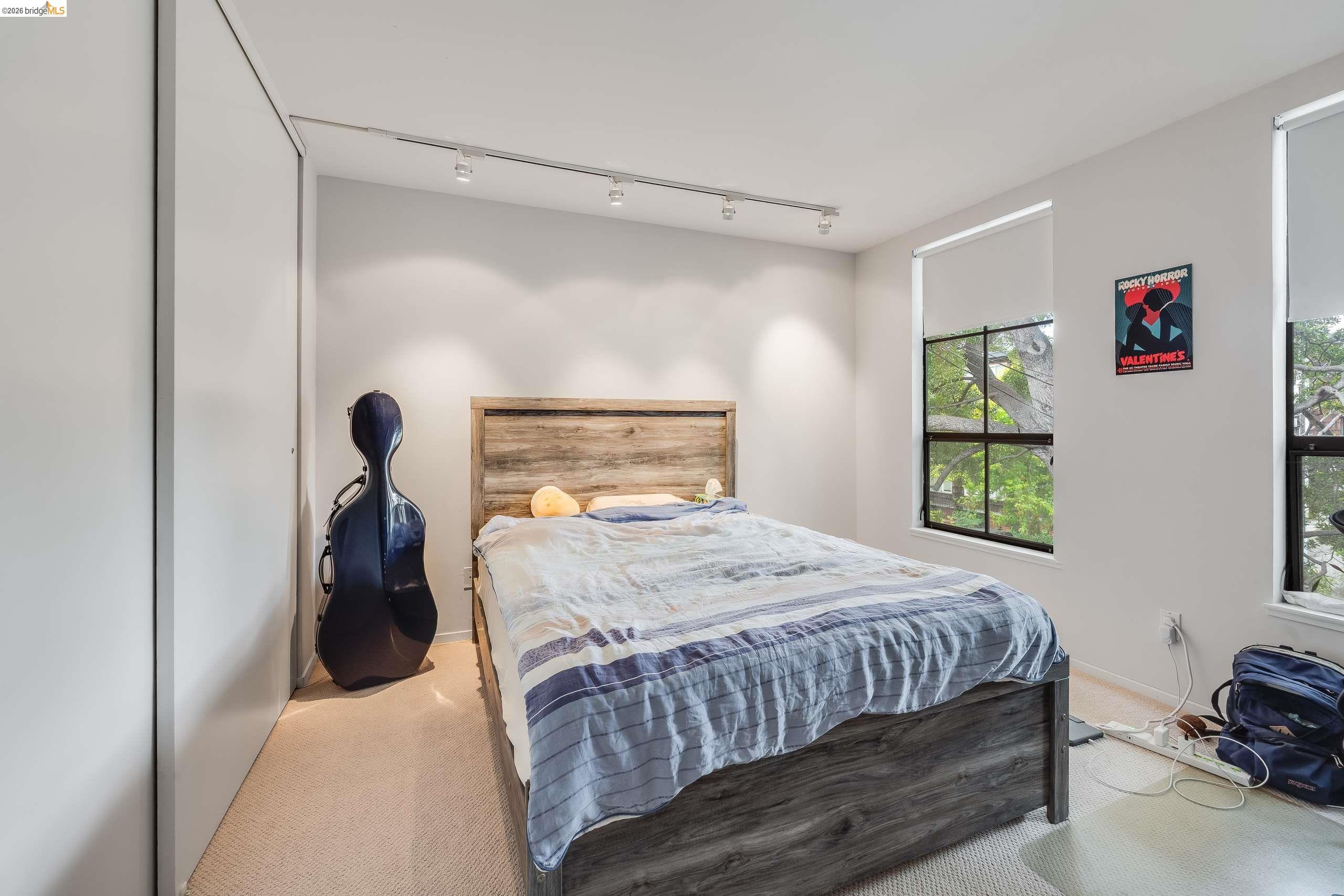 2316 Blake Street, Unit A Berkeley, CA 94704 - Photo 24 of 30 Bedroom featuring light colored carpet and rail lighting