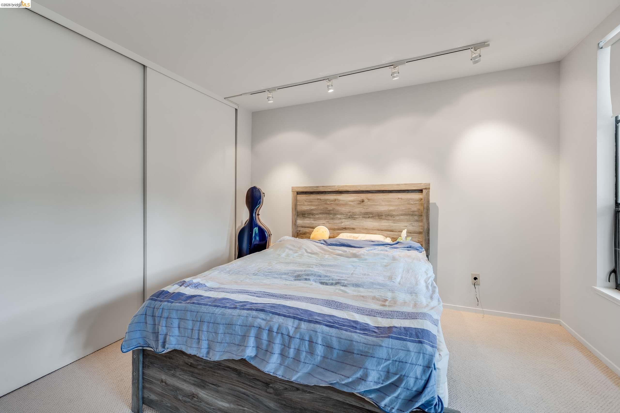 2316 Blake Street, Unit A Berkeley, CA 94704 - Photo 25 of 30 Bedroom with track lighting and carpet