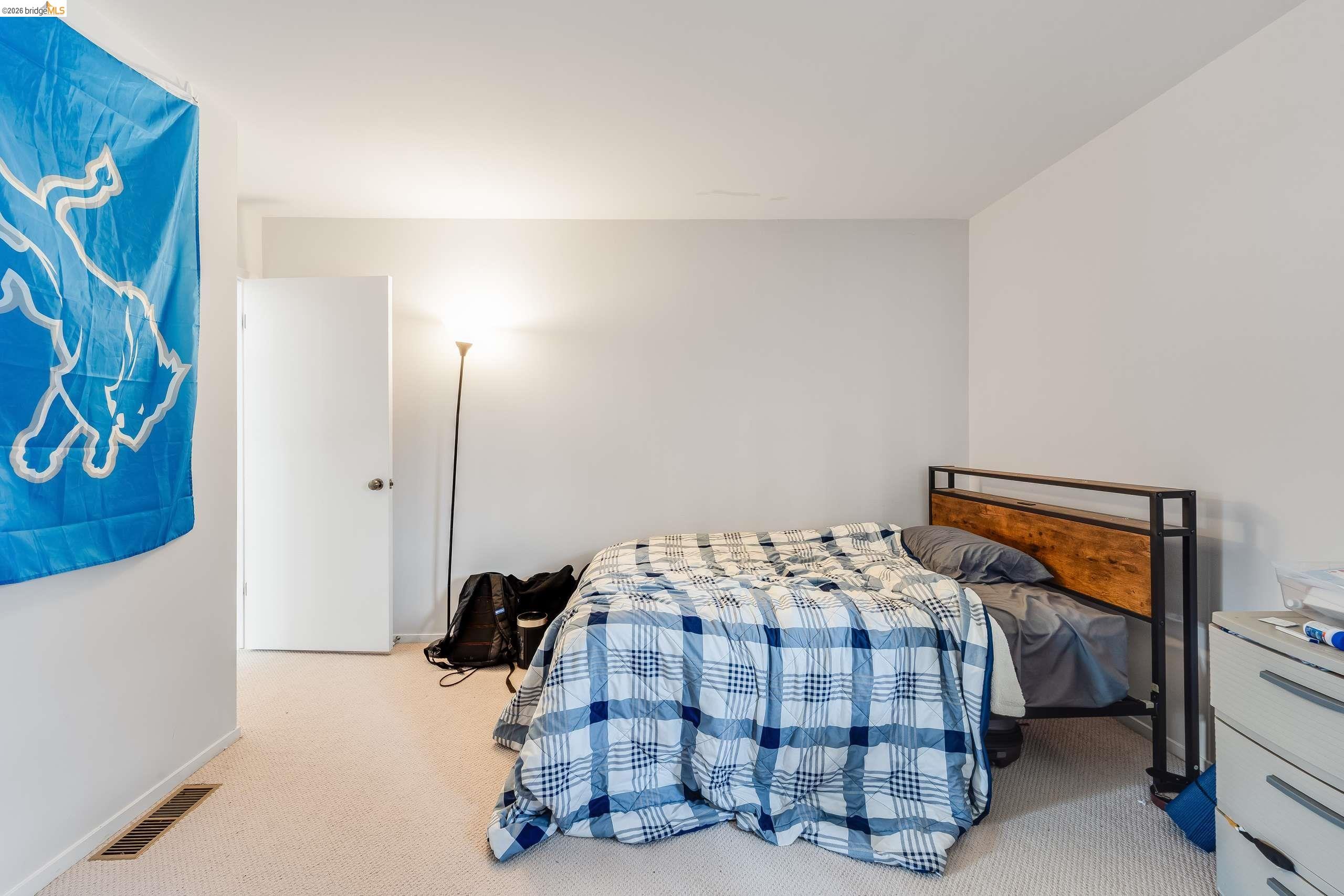 2316 Blake Street, Unit A Berkeley, CA 94704 - Photo 27 of 30 Bedroom featuring light carpet and baseboards