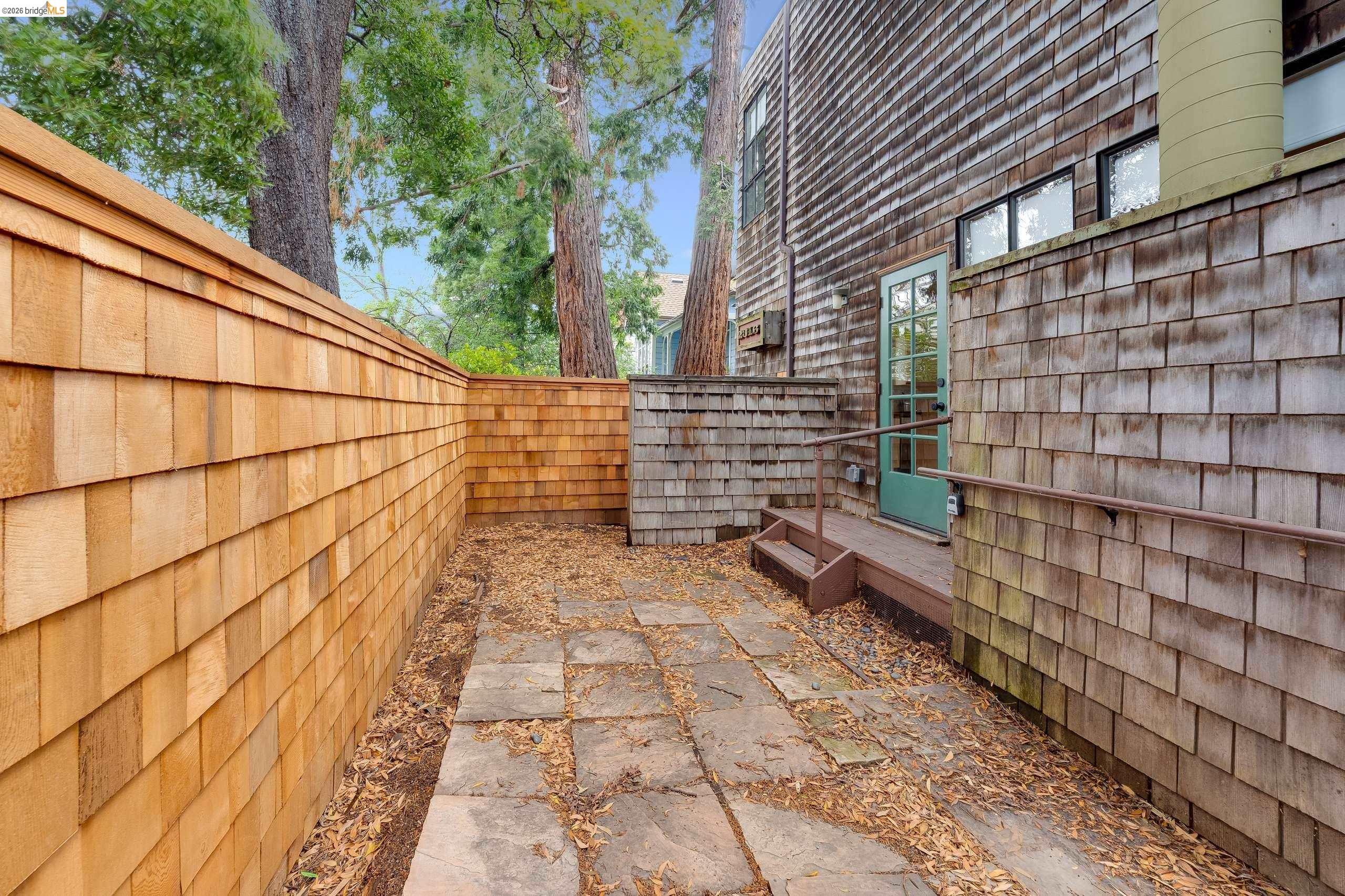 2316 Blake Street, Unit A Berkeley, CA 94704 - Photo 30 of 30 Fenced backyard with a wooden deck
